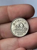 Reverse side showing beaver design, date 1939, denomination 5 cents