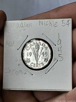 Reverse of 1945 Canada 5-cent Victory nickel in coin flip