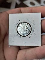 Reverse of 1953 Canadian 5 cents coin showing beaver design and date