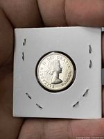 Obverse side of 1964 Canada 5 cent coin showing Queen Elizabeth II within 2x2 holder