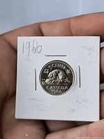 Reverse side of coin with beaver and 1966 date