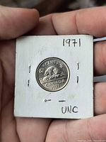 Reverse side of 1971 5-cent coin in flip