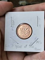Obverse view of 2012 Canadian penny in holder