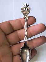 Front view showing star finial, Bethlehem banner, and handle design