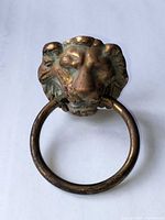 front view of lion head holder with ring