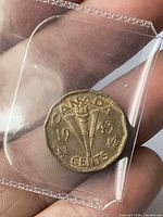 Reverse showing CANADA, 1943, torch and V design