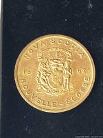 Obverse of token showing Nova Scotia coat of arms, date 1867