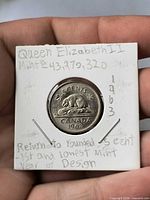 Reverse of 1963 Canada 5¢ coin showing beaver design and date, with handwritten holder notes visible