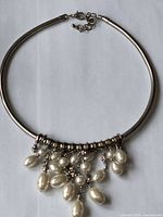 Full view of necklace showing chain, clasp, and faux pearl drops