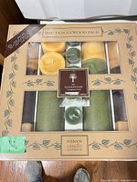 Box front showing Partylite Tanglewood Pack branding and contents outlined