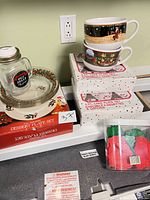 Overall view of boxed plate sets, bowls, jar mug and cookie cutters