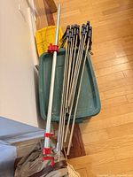 Stack of eleven bar clamps and one long pipe clamp