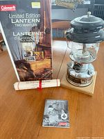Lantern on wood base with box, certificate scroll, manual booklet