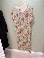 Green floral lace dress hanging