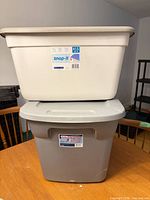 Two stacked storage bins showing overall condition and colours