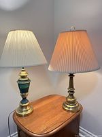 Two table lamps on wooden surface showing overall appearance