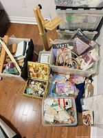 Overhead view showing bins filled with hoops, kits, fabric, wooden floor stand