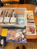 Overall view of tote, magazine holders, loose magazines and booklets