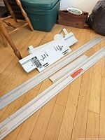 Mitremate base with extension rails on floor