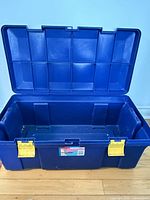 Open Rubbermaid RoughTote showing interior and lid