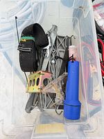 Bin with strap, flashlight, leveling pads, bracket, rods and hardware