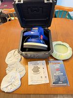 Polisher inside open case with accessories laid out
