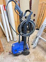 Front view showing Simoniz pressure washer, spray gun, hose, cord, wheels