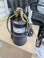 Full view of pump with rope and cord