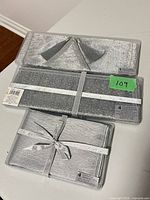 Sealed packages of runner, napkins and placemats