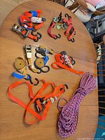 Overview of all ratchet straps and braided rope on table