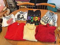 All seven tops laid out on table front view