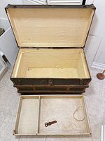 Trunk open showing tray and interior