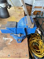 Top view of blue Mastercraft swivel bench vise showing jaws, anvil and base