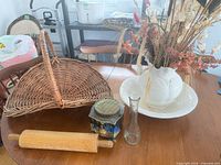 Overview of basket, rolling pin, tin, bud vase, ceramic pitcher and basin