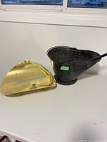 Ash bucket and brass tray side by side