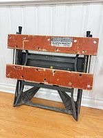 Folded Black & Decker Workmate bench showing label and jaws