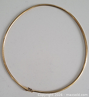 Full view of gold necklace closed