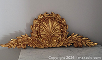 Full view of gilded Rococo plaster ornament on surface