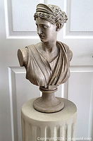 Full view of composite stone Diana bust on column