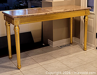 Full view of gilt wood console table with marble top