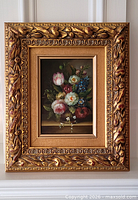 Frontal view of painting and ornate frame
