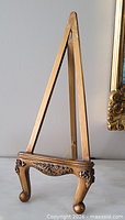 full view of carved wooden tabletop easel