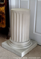Front view of composite stone fluted pedestal