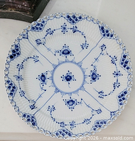 Top view of Royal Copenhagen Blue Fluted Full Lace plate showing full pattern and scalloped rim