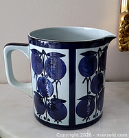 Overall side view showing decorative panels, handle partially visible