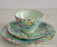 Trio upright showing pattern and cup interior