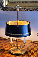 Full view of lamp showing shade, finial, and candlestick form