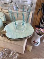 Glass with turquoise motif on coasters, plus coaster holder detail