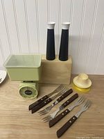 Full lot showing scale, cutlery, shakers, egg cups