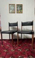 Both teak side chairs front view
